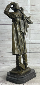 Country Western Cowboy Hauling Saddle Bronze Sculpture