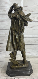 Country Western Cowboy Hauling Saddle Bronze Sculpture