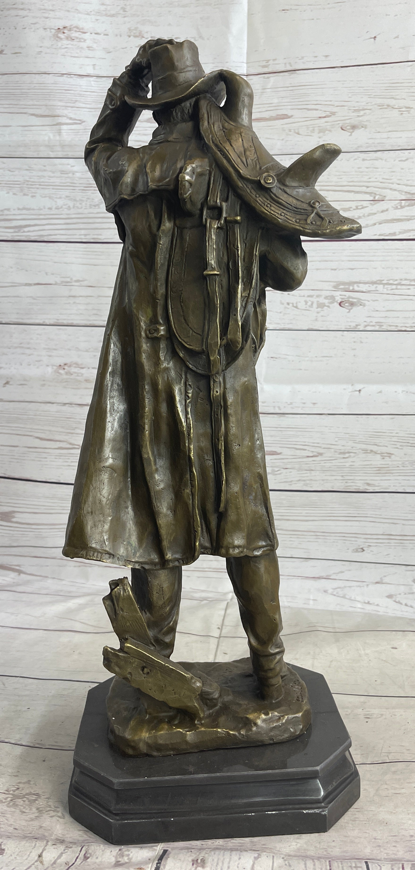 Country Western Cowboy Hauling Saddle Bronze Sculpture