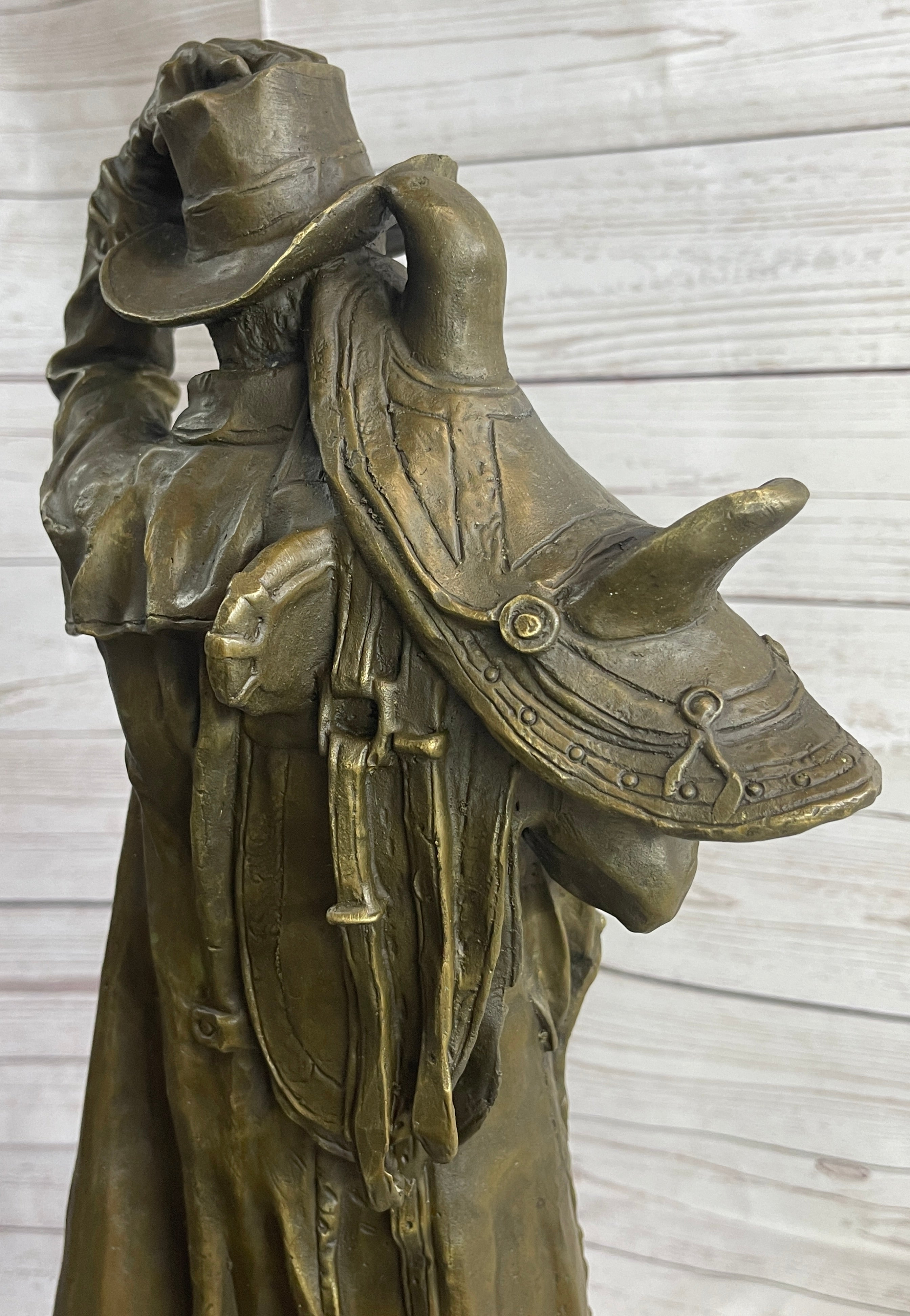 Country Western Cowboy Hauling Saddle Bronze Sculpture