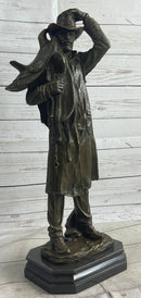 Country Western Cowboy Hauling Saddle Bronze Sculpture