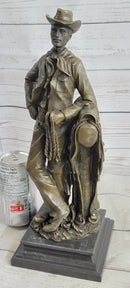 Signed Patoue Cowboy with Rope Bronze Sculpture