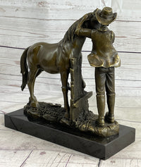 Cowboy Rancher Tending Horse Bronze Sculpture 11" x 12"