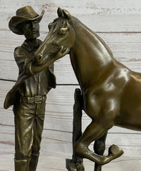 Cowboy Rancher Tending Horse Bronze Sculpture 11" x 12"