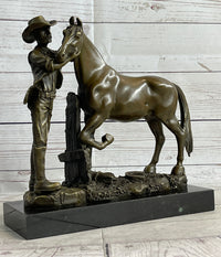 Cowboy Rancher Tending Horse Bronze Sculpture 11" x 12"