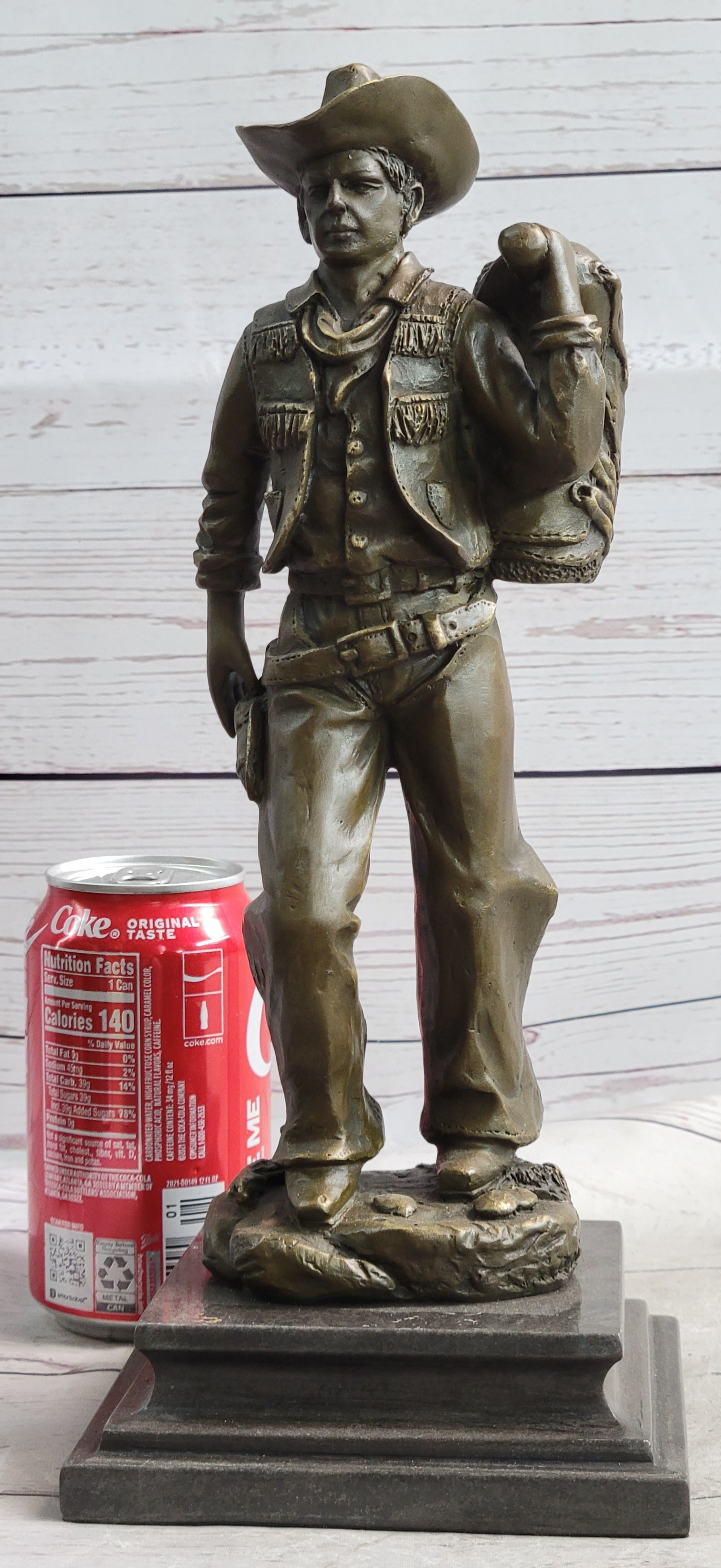Cowboy in Chaps Carrying Horse Saddle Bronze 12" x 4"