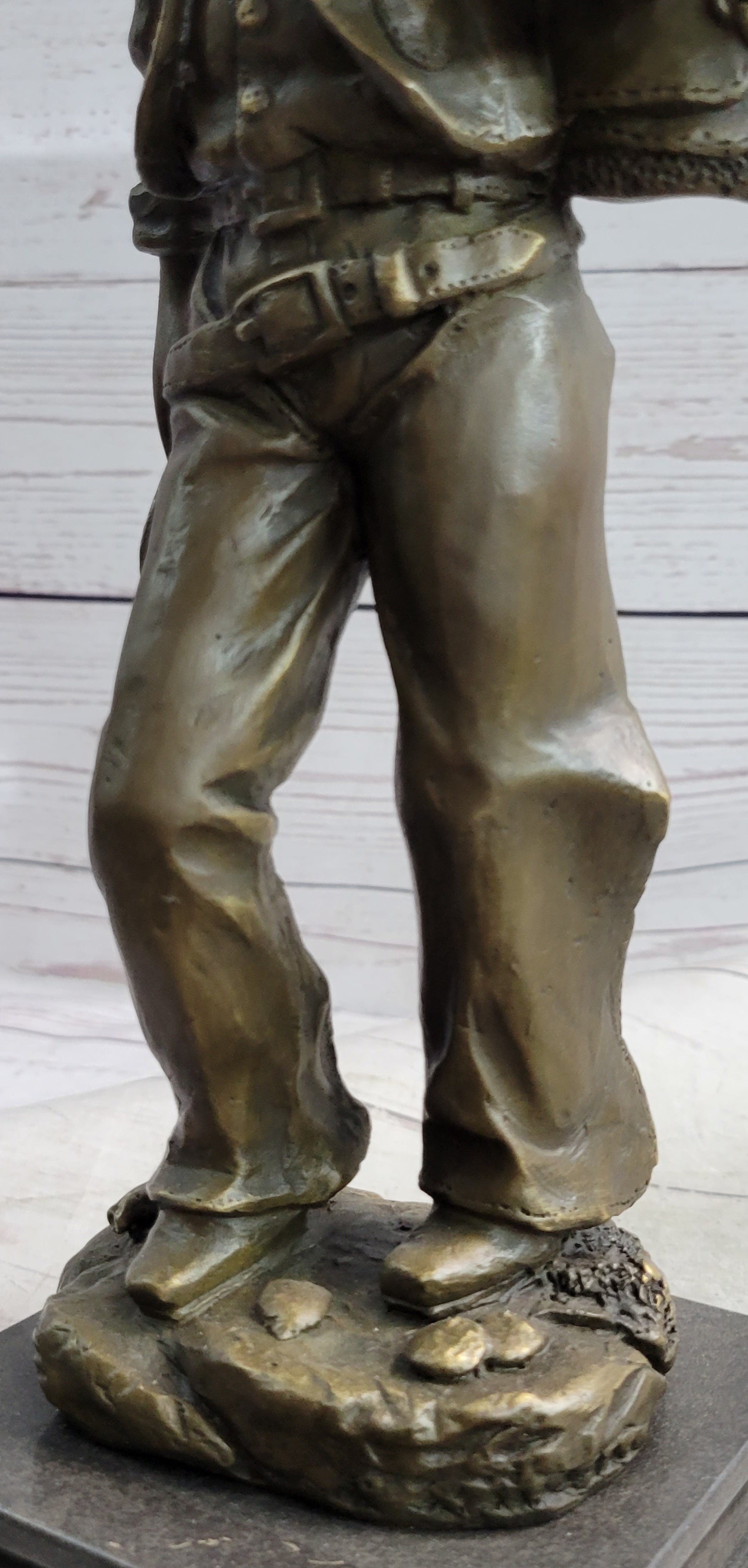 Cowboy in Chaps Carrying Horse Saddle Bronze 12" x 4"