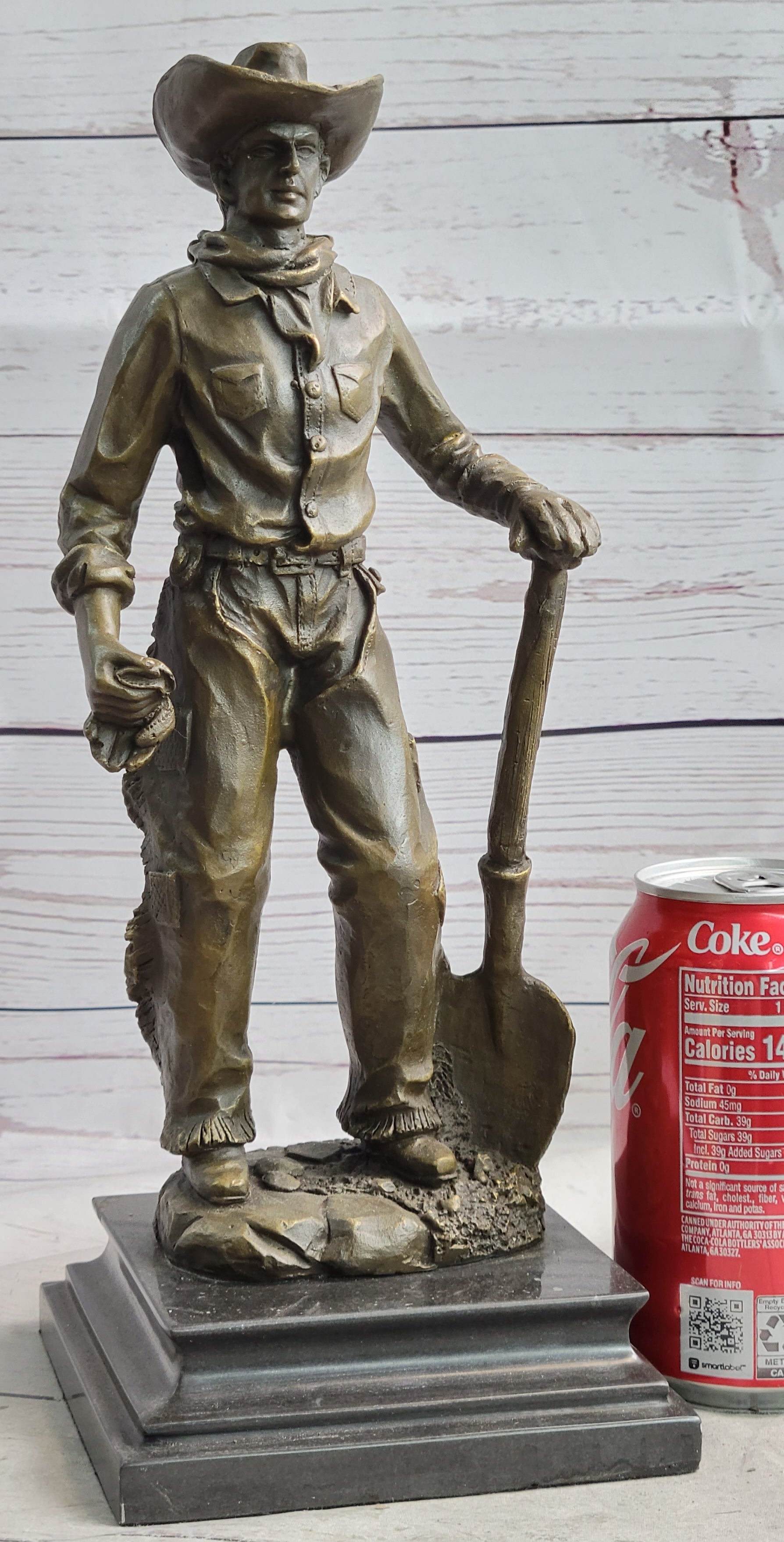Cowboy in Chaps Holding Shovel Bronze 12" x 5"