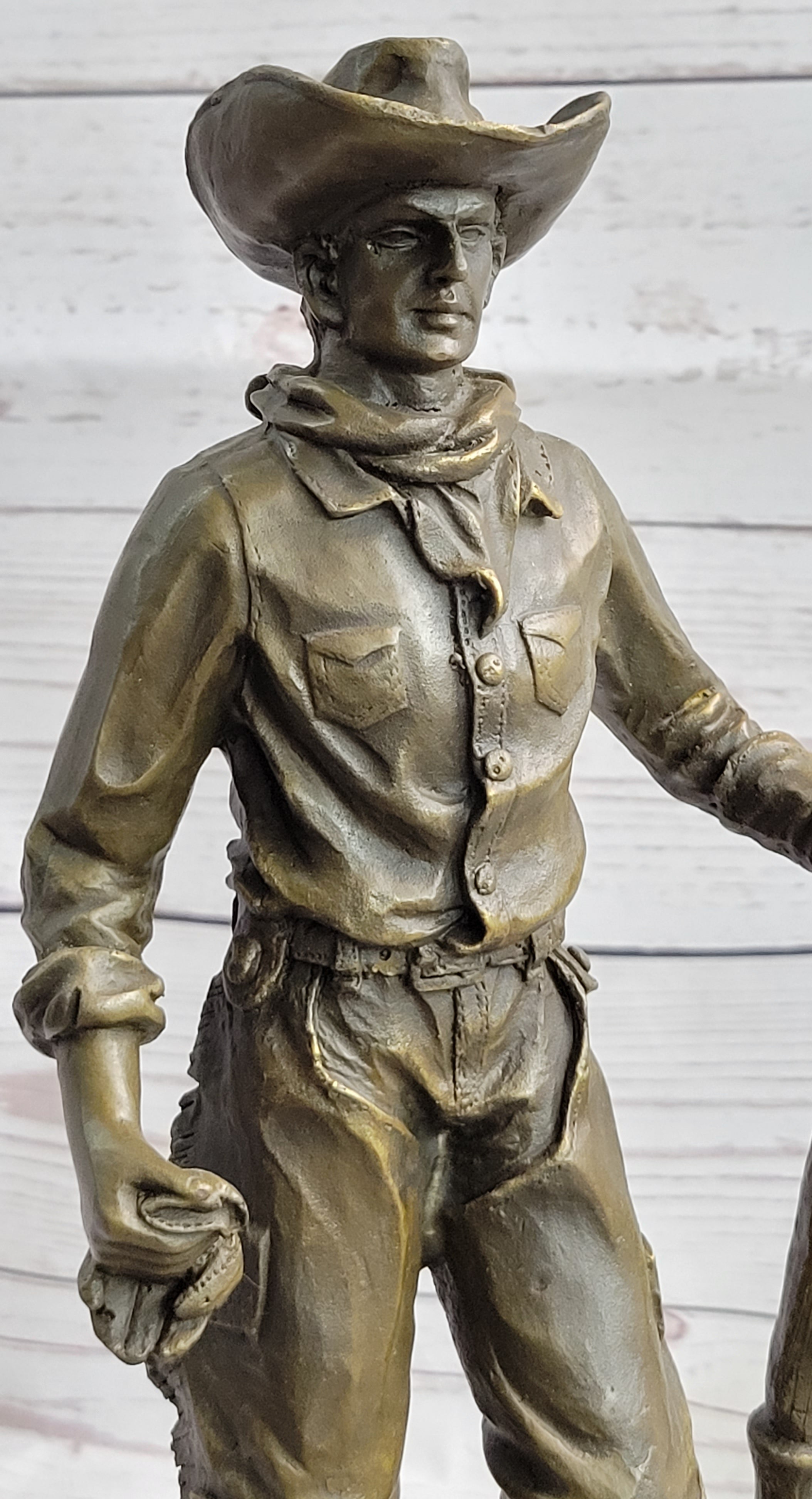 Cowboy in Chaps Holding Shovel Bronze 12" x 5"