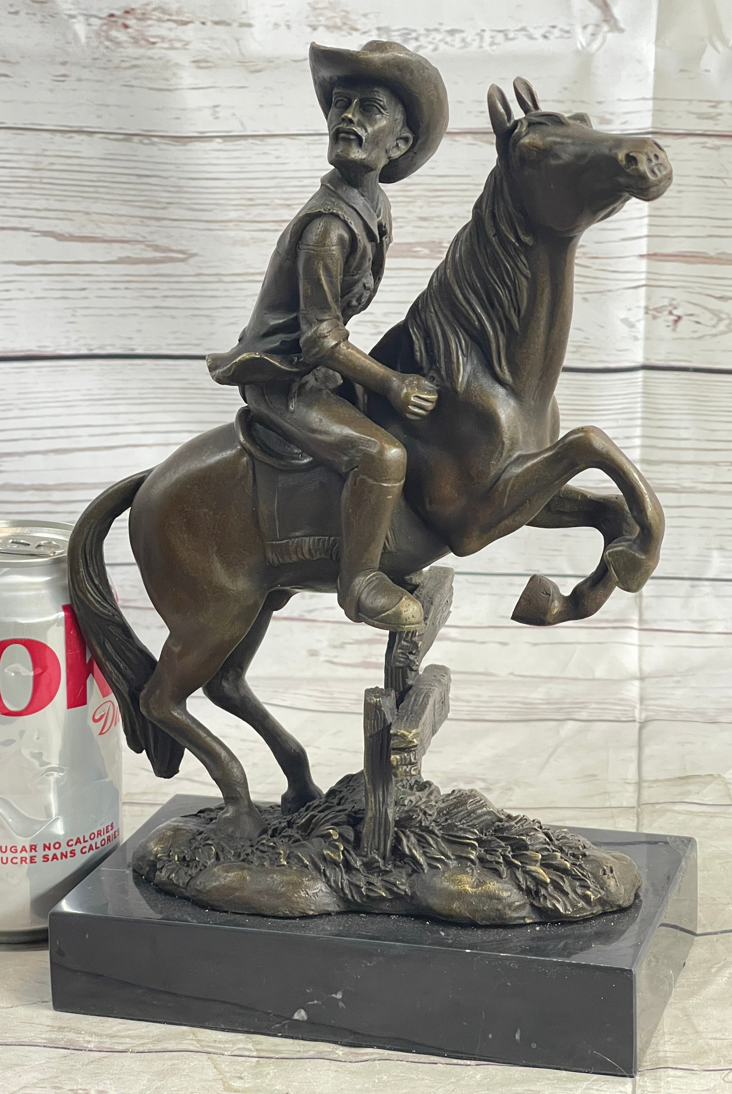 Cowboy on Horseback Hopping a Fence Bronze Sculpture