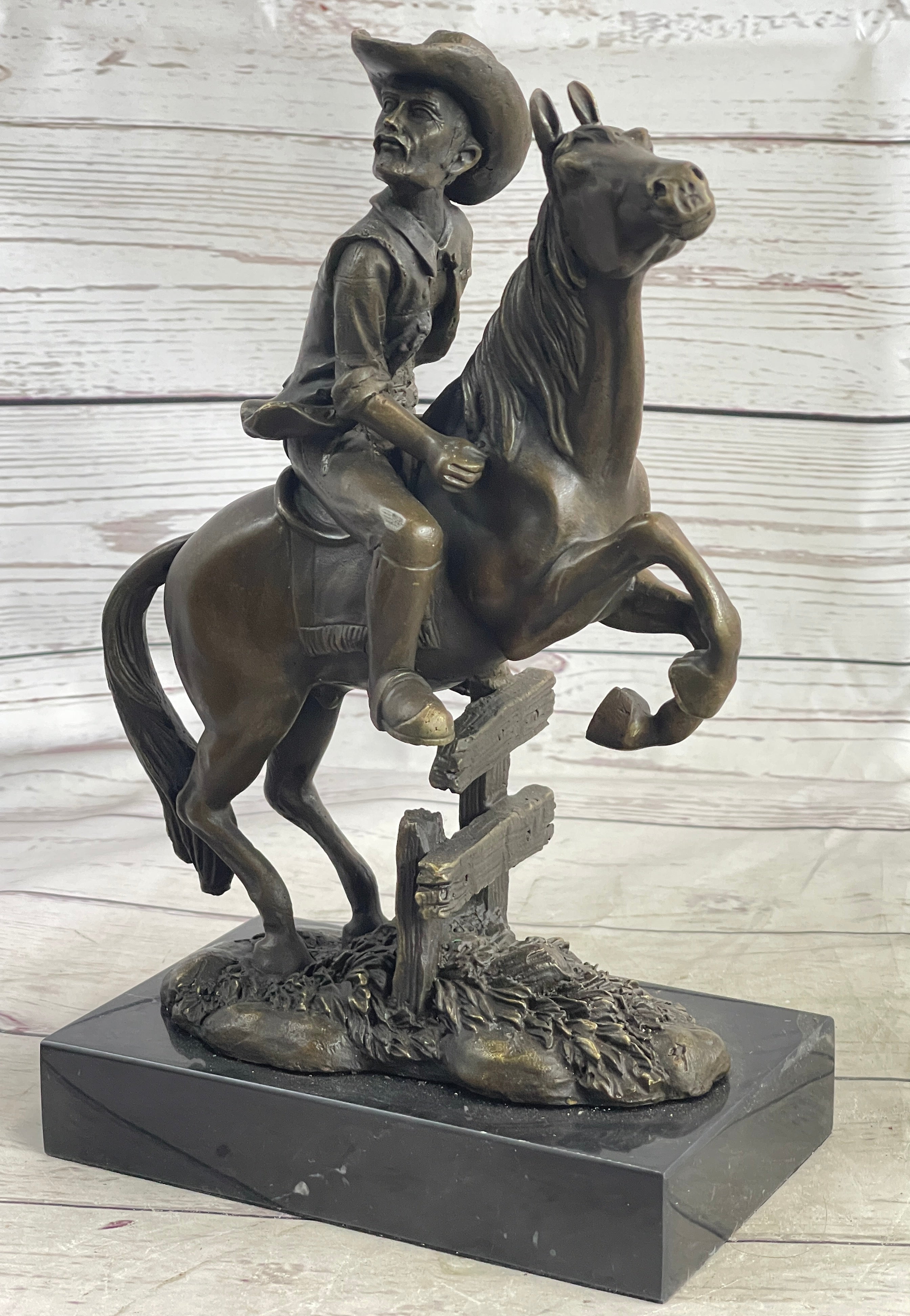 Cowboy on Horseback Hopping a Fence Bronze Sculpture