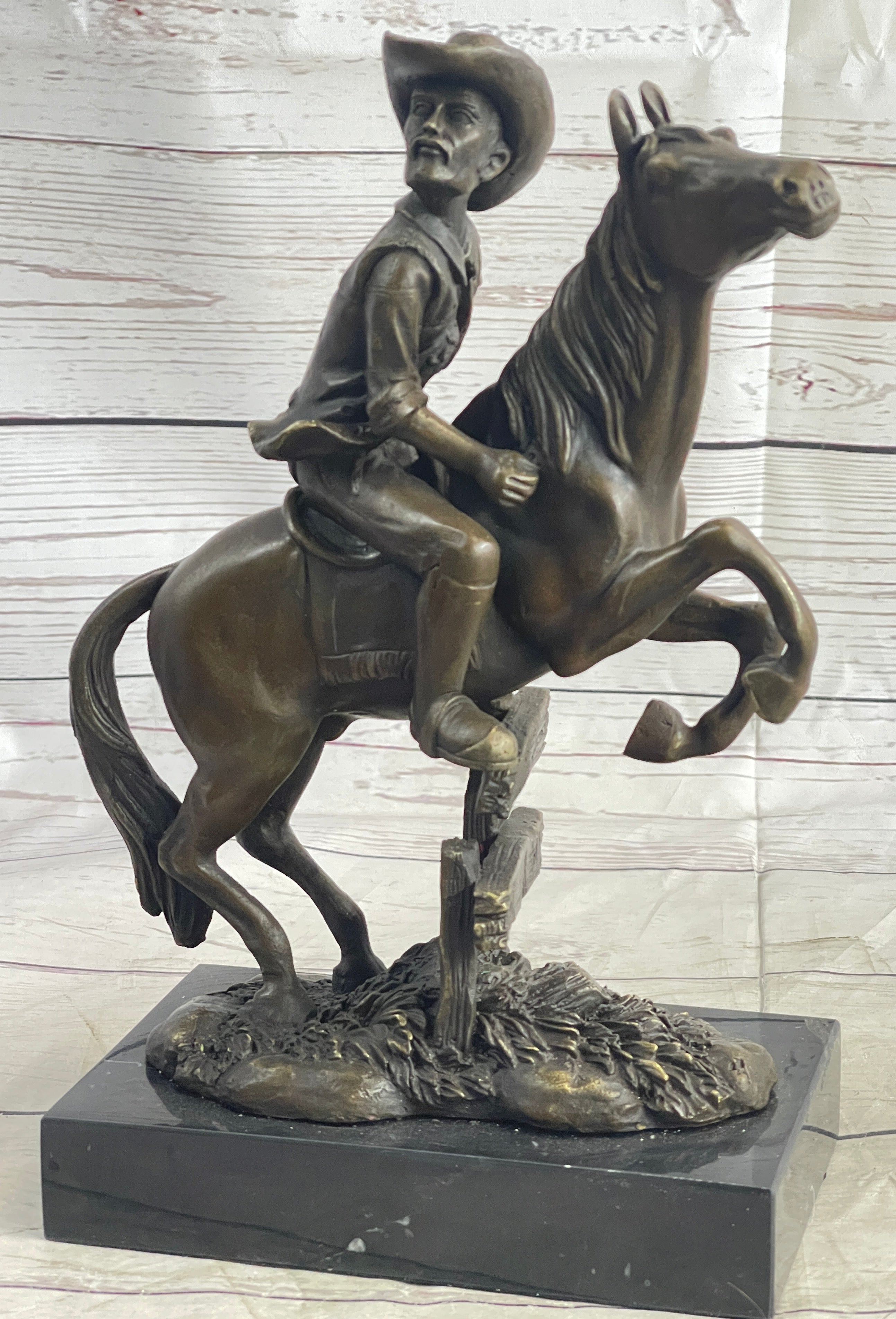 Cowboy on Horseback Hopping a Fence Bronze Sculpture