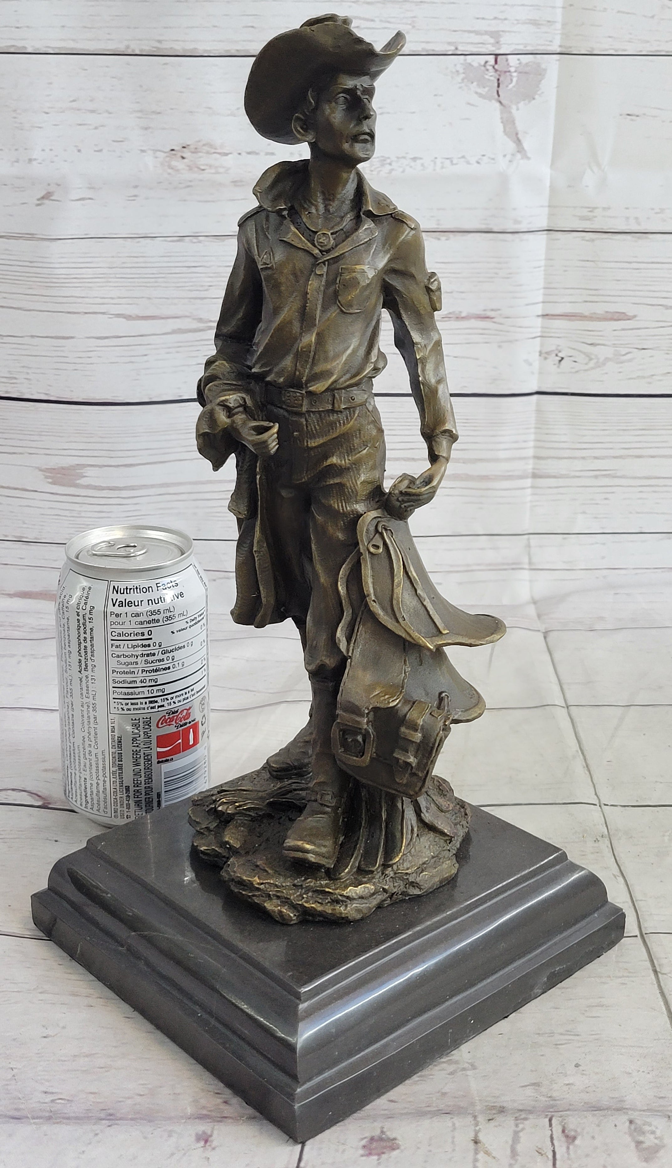 Cowboy Holding Horse Saddle Bronze Sculpture 13" x 6"