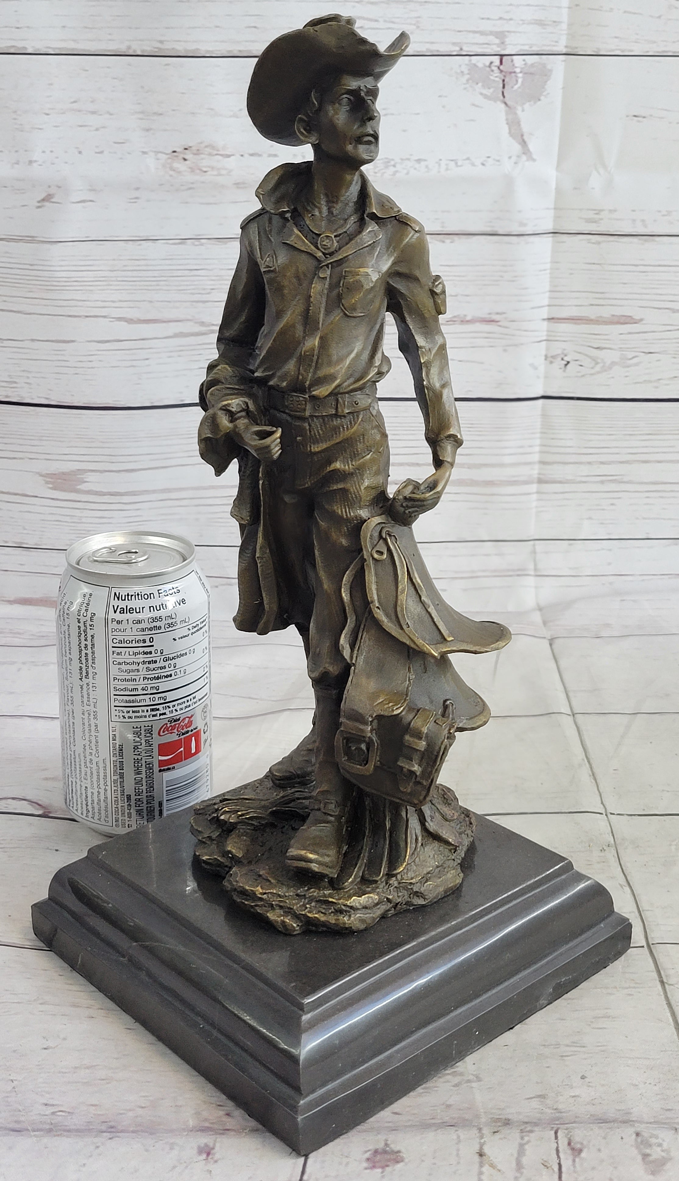 Cowboy Holding Horse Saddle Bronze Sculpture 13" x 6"