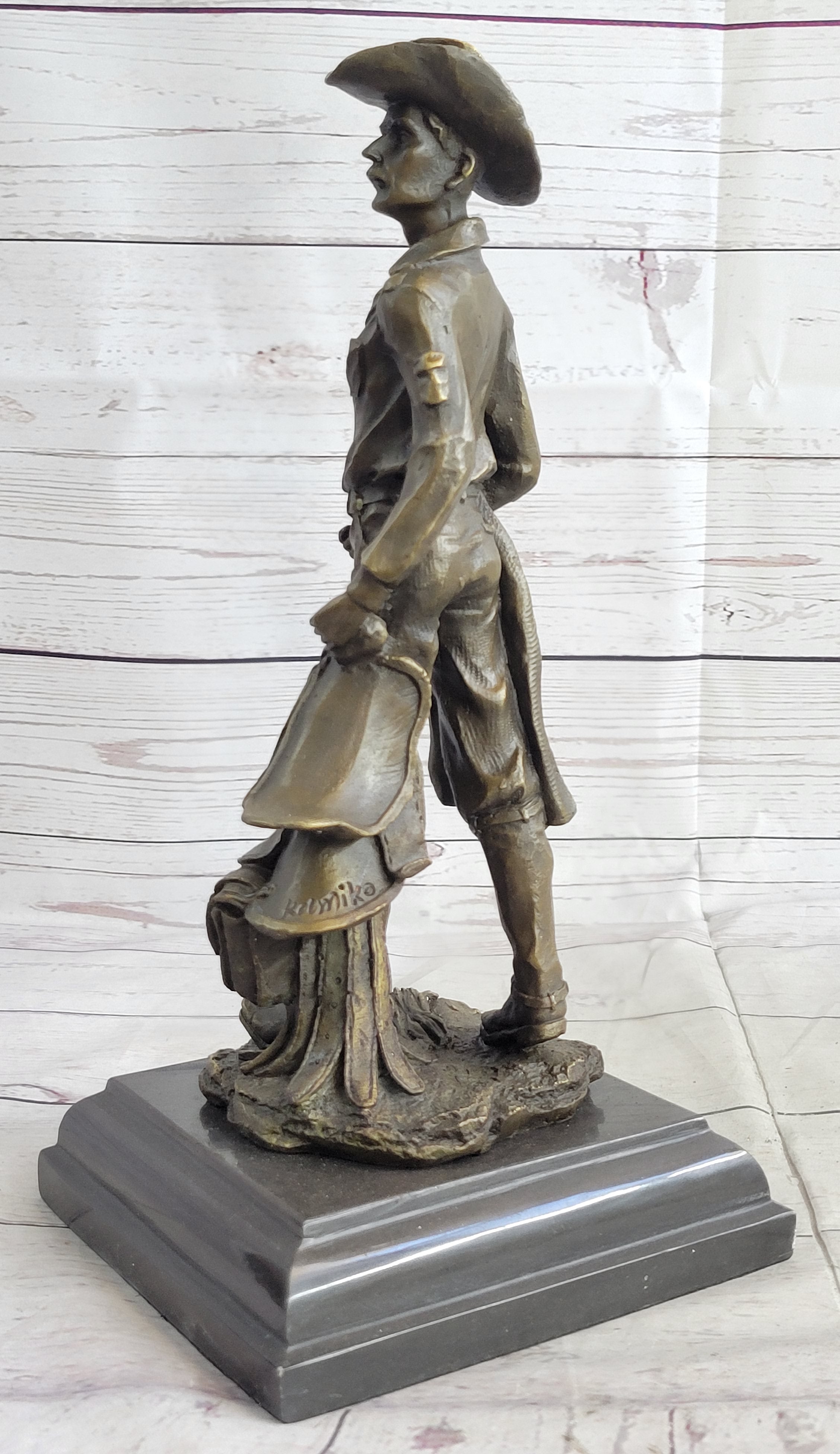 Cowboy Holding Horse Saddle Bronze Sculpture 13" x 6"