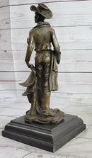 Cowboy Holding Horse Saddle Bronze Sculpture 13" x 6"