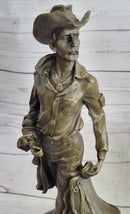 Cowboy Holding Horse Saddle Bronze Sculpture 13" x 6"