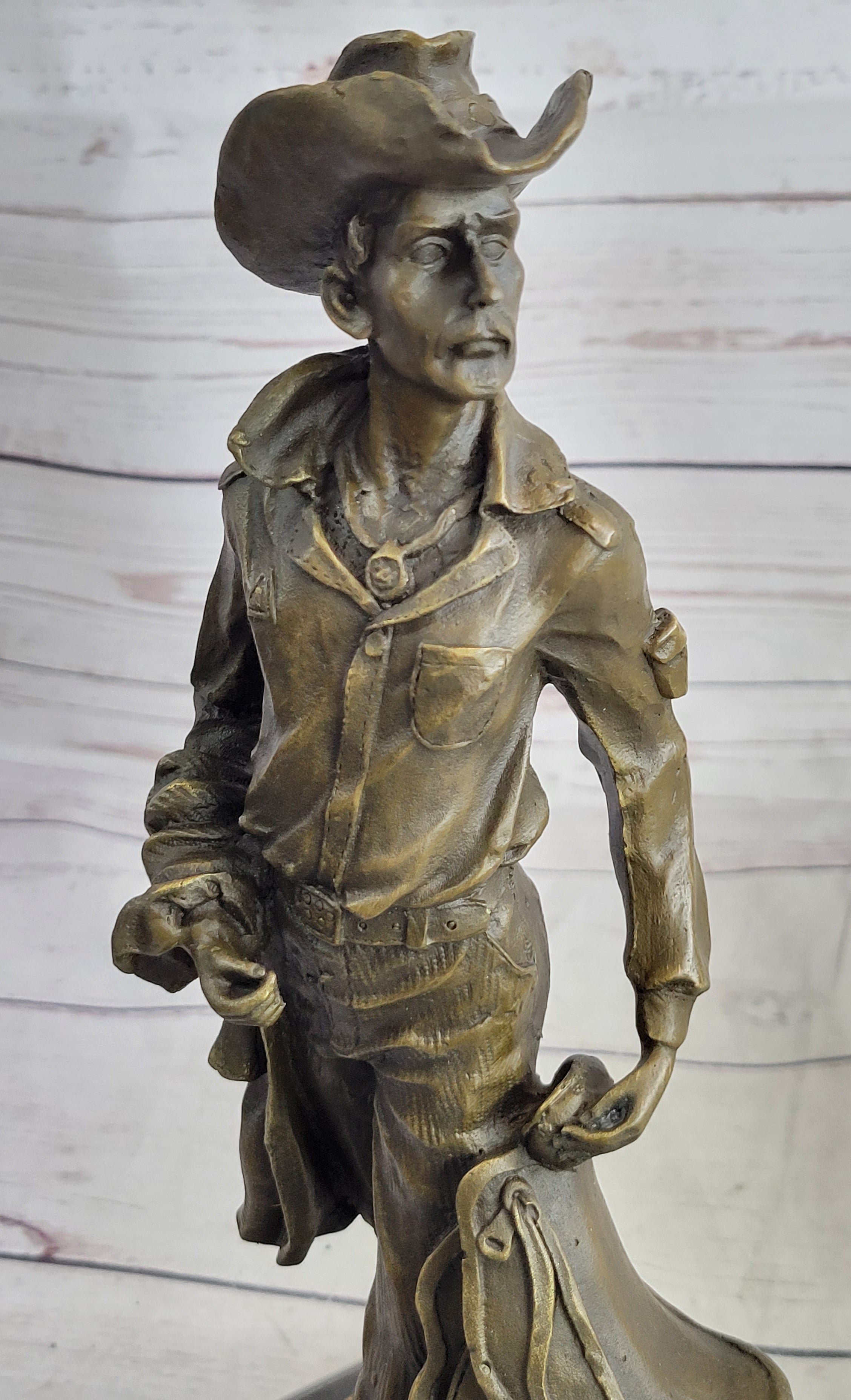 Cowboy Holding Horse Saddle Bronze Sculpture 13" x 6"