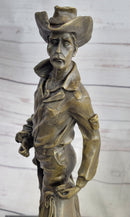 Cowboy Holding Horse Saddle Bronze Sculpture 13" x 6"