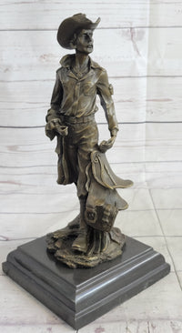 Cowboy Holding Horse Saddle Bronze Sculpture 13" x 6"
