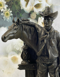 Cowboy Saddling Horse Bronze Sculpture 16" x 8"