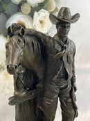 Cowboy Saddling Horse Bronze Sculpture 16" x 8"