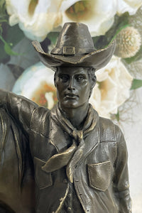 Cowboy Saddling Horse Bronze Sculpture 16" x 8"