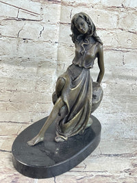 Young Girl Laying Against Rock Bronze Figure 8" x 6"