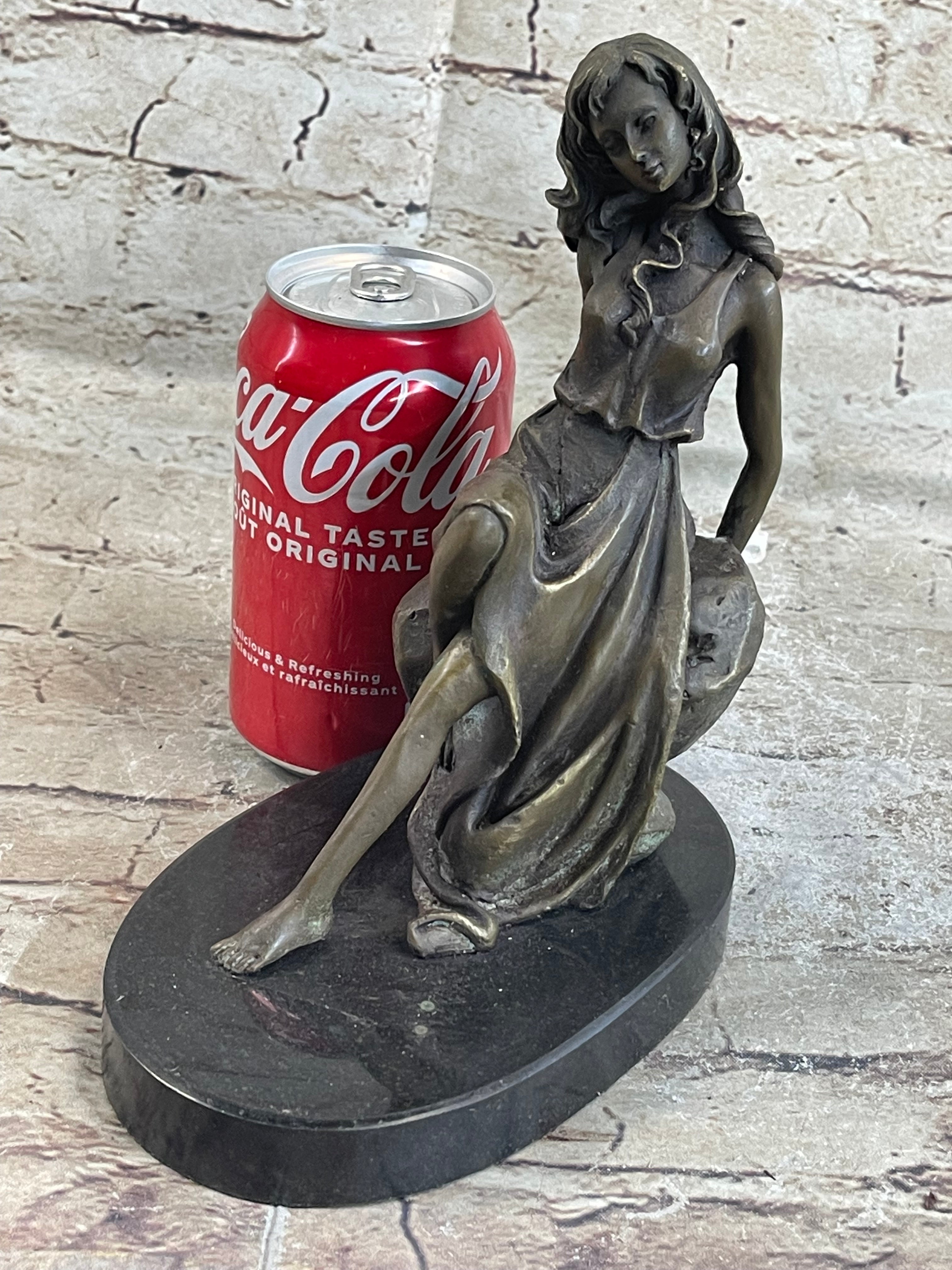 Young Girl Laying Against Rock Bronze Figure 8" x 6"