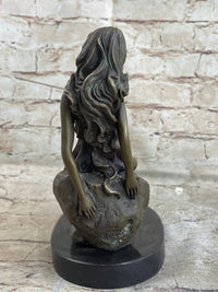 Young Girl Laying Against Rock Bronze Figure 8" x 6"