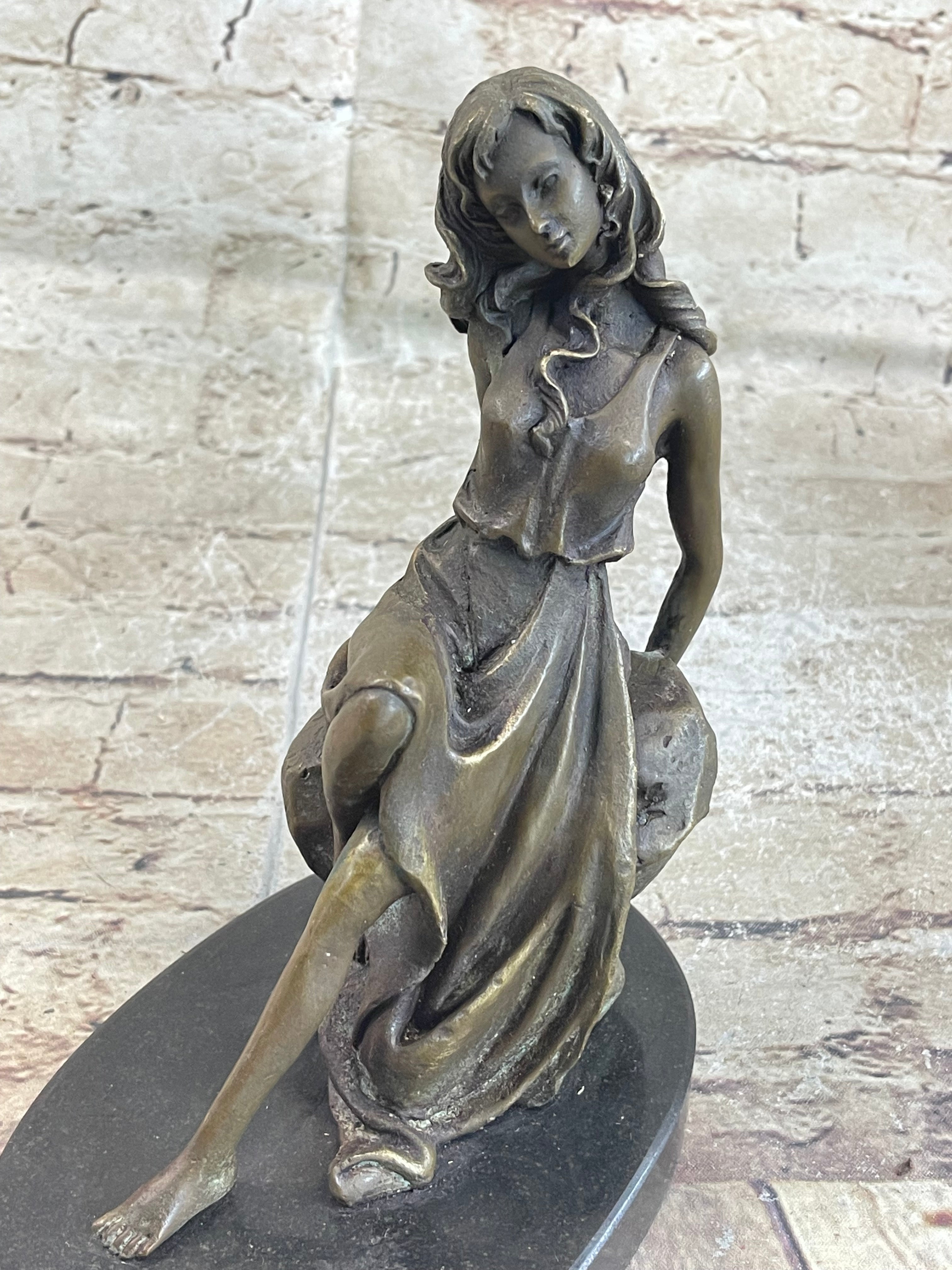 Young Girl Laying Against Rock Bronze Figure 8" x 6"
