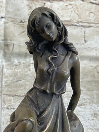 Young Girl Laying Against Rock Bronze Figure 8" x 6"