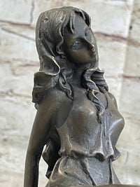 Young Girl Laying Against Rock Bronze Figure 8" x 6"