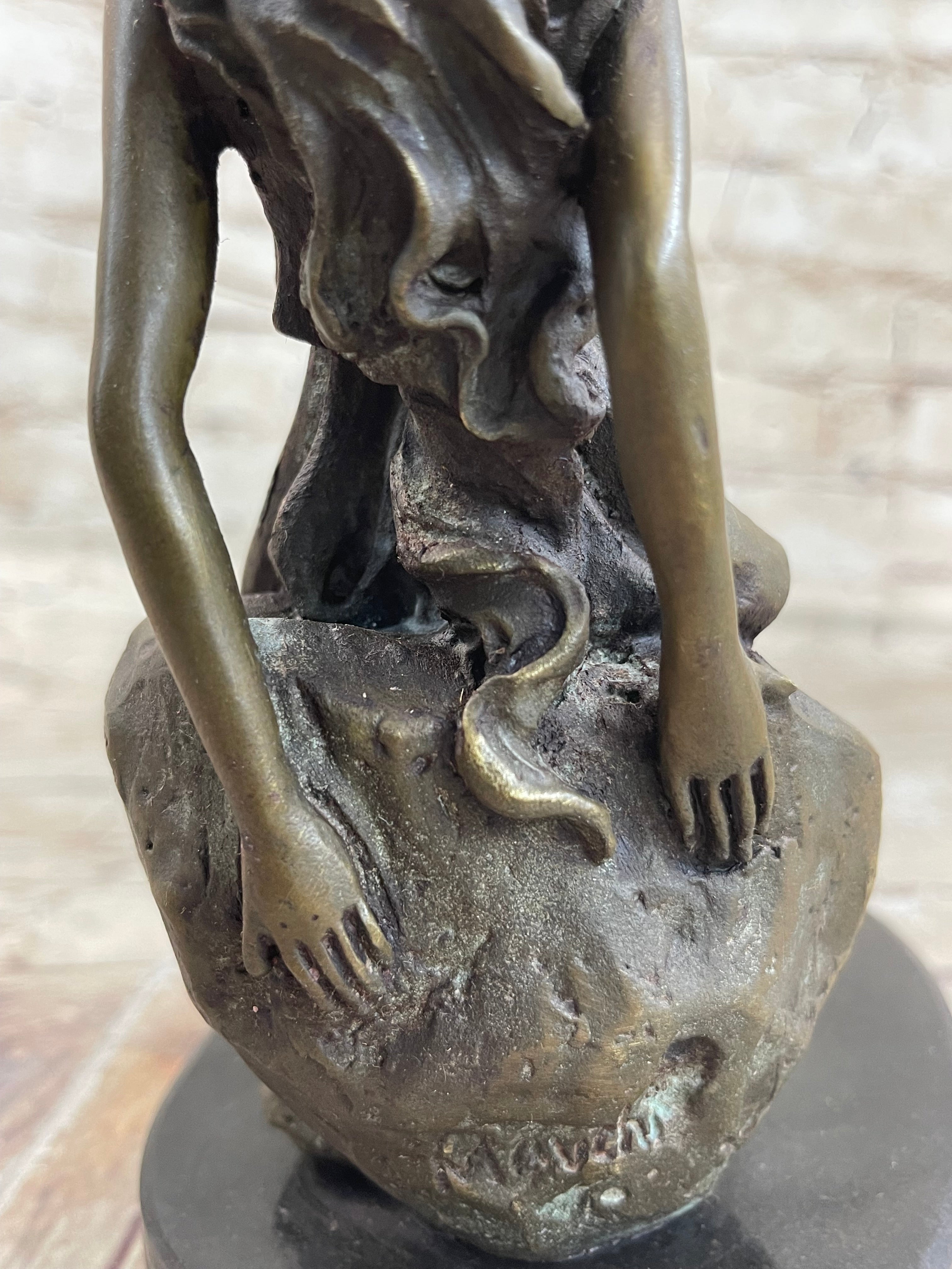 Young Girl Laying Against Rock Bronze Figure 8" x 6"