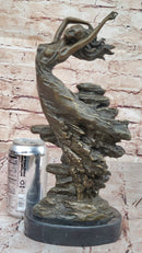 Bronze Sculpture of Woman Embracing Wind – Flowing Gown