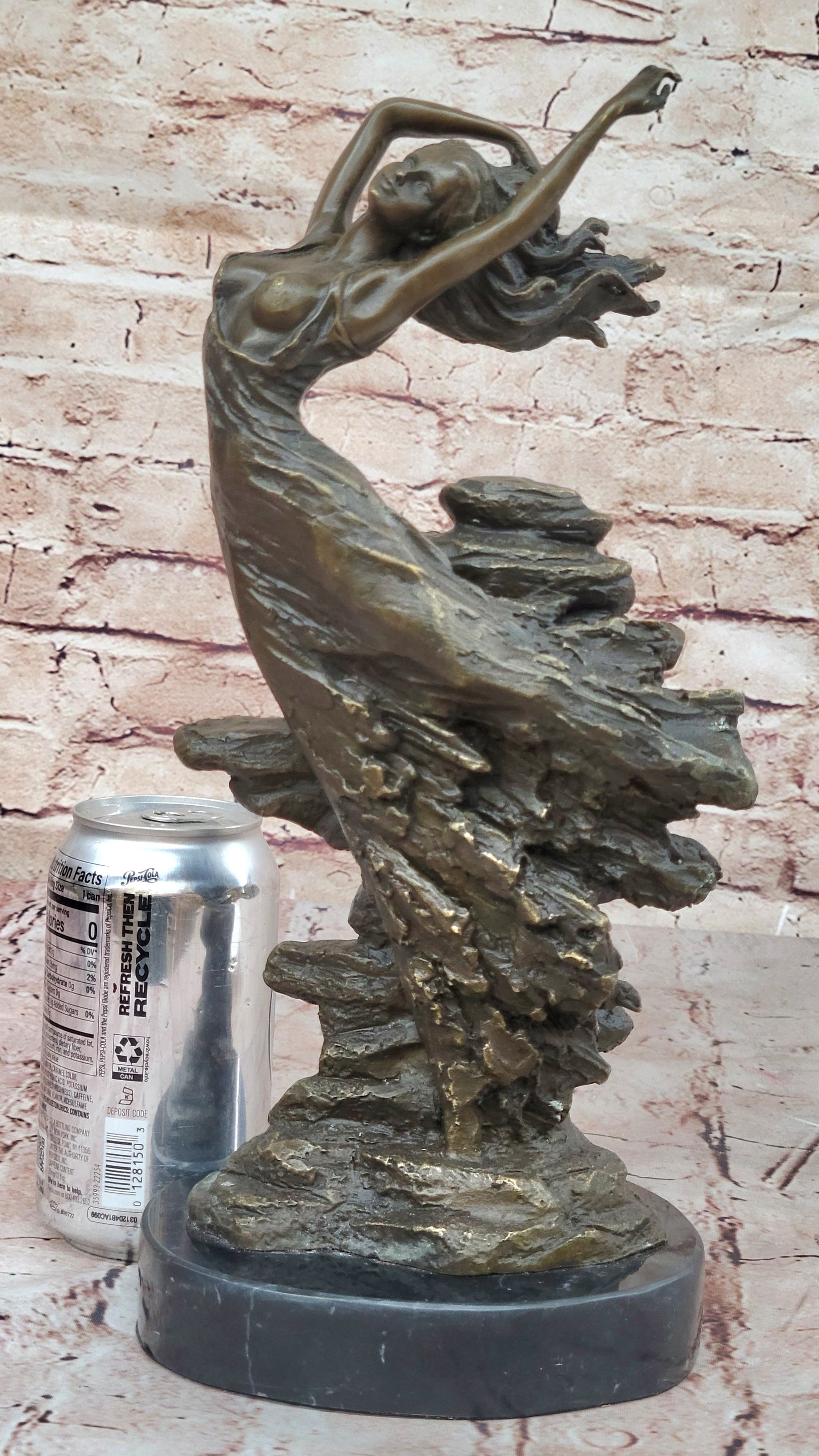 Bronze Sculpture of Woman Embracing Wind – Flowing Gown