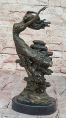Bronze Sculpture of Woman Embracing Wind – Flowing Gown