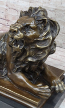 Roaring Guardian Lion Laying Down Bronze Sculpture on Marble Base