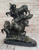 Bronze Sculpture of Rams on Rocky Outcrop – Wildlife Scene