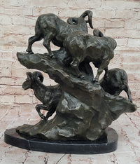 Bronze Sculpture of Rams on Rocky Outcrop – Wildlife Scene