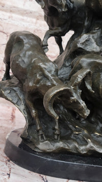 Bronze Sculpture of Rams on Rocky Outcrop – Wildlife Scene