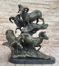 Bronze Sculpture of Rams on Rocky Outcrop – Wildlife Scene