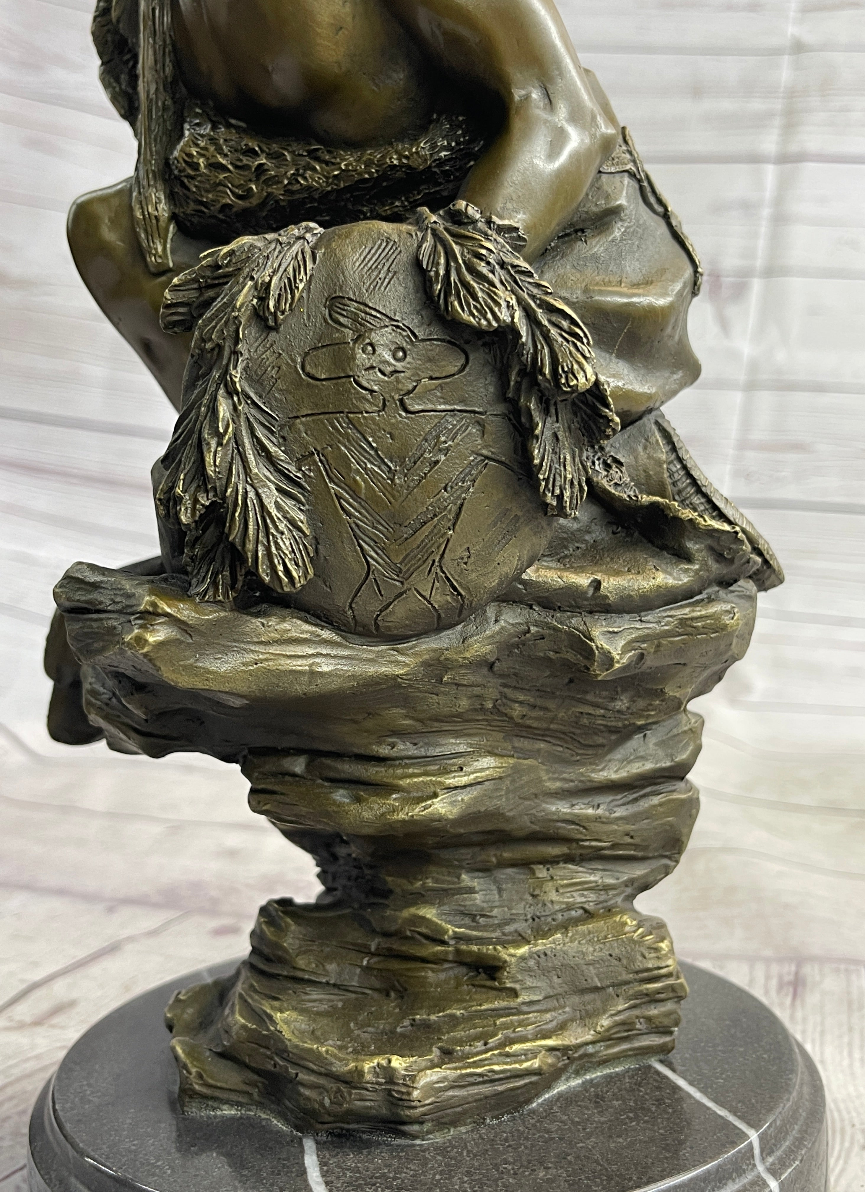 Native American Indian Warrior Squatting on Rock Bronze Sculpture