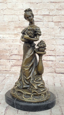 Victorian Edwardian Young Woman Holding Puppy - Bronze by Milo