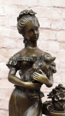 Victorian Edwardian Young Woman Holding Puppy - Bronze by Milo