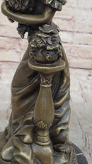 Victorian Edwardian Young Woman Holding Puppy - Bronze by Milo