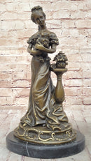 Victorian Edwardian Young Woman Holding Puppy - Bronze by Milo