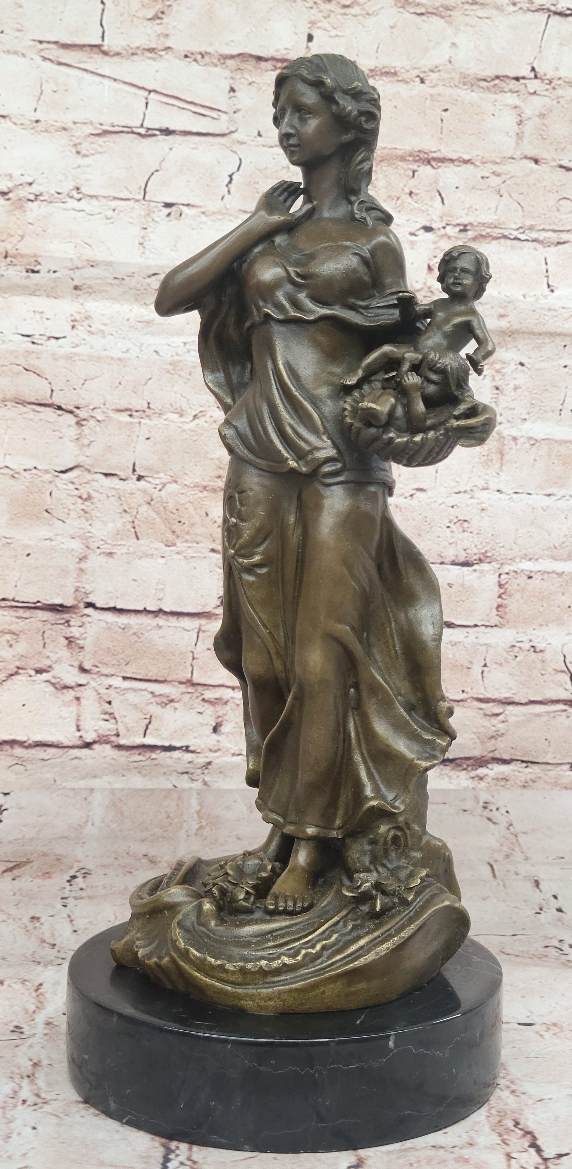 Bronze Mother and Child in Basket - Elegant Sculpture
