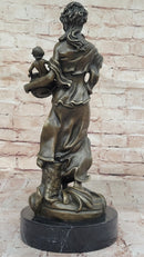 Bronze Mother and Child in Basket - Elegant Sculpture