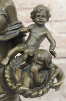 Bronze Mother and Child in Basket - Elegant Sculpture